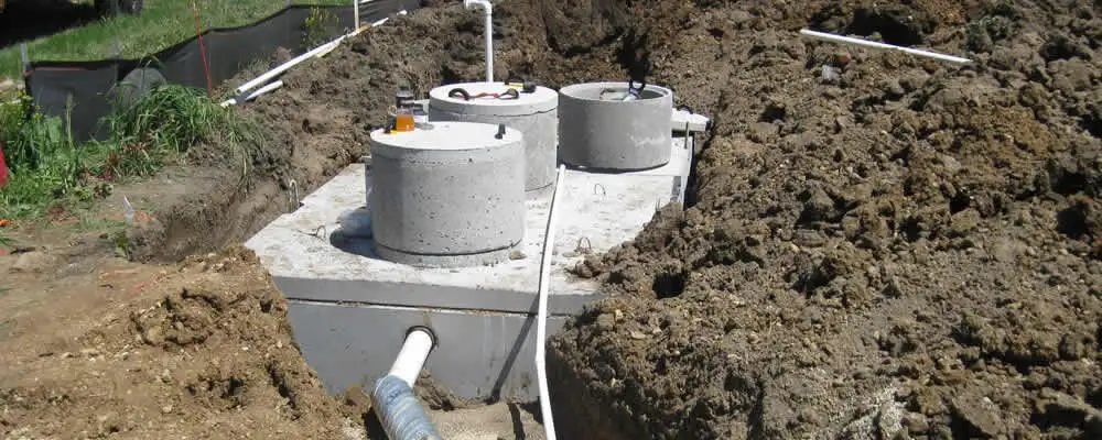 Septic system repair and installation site with tank access ports in Tacoma, WA