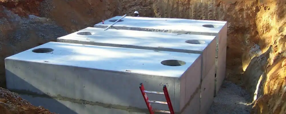 Septic tank installation site with a newly placed concrete tank in Tacoma, WA